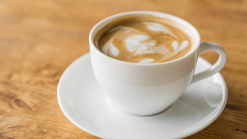 Latte Coffee art on the wooden table