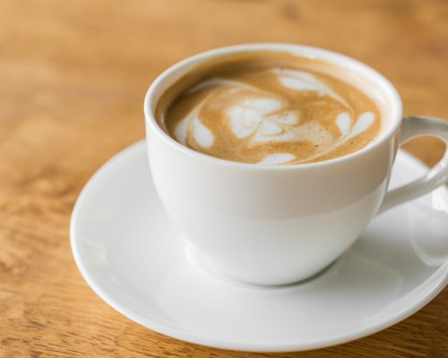 Latte Coffee art on the wooden table