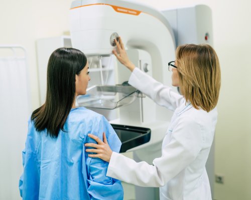 Young woman is having mammography examination at the hospital or private clinic with a professional female doctor.